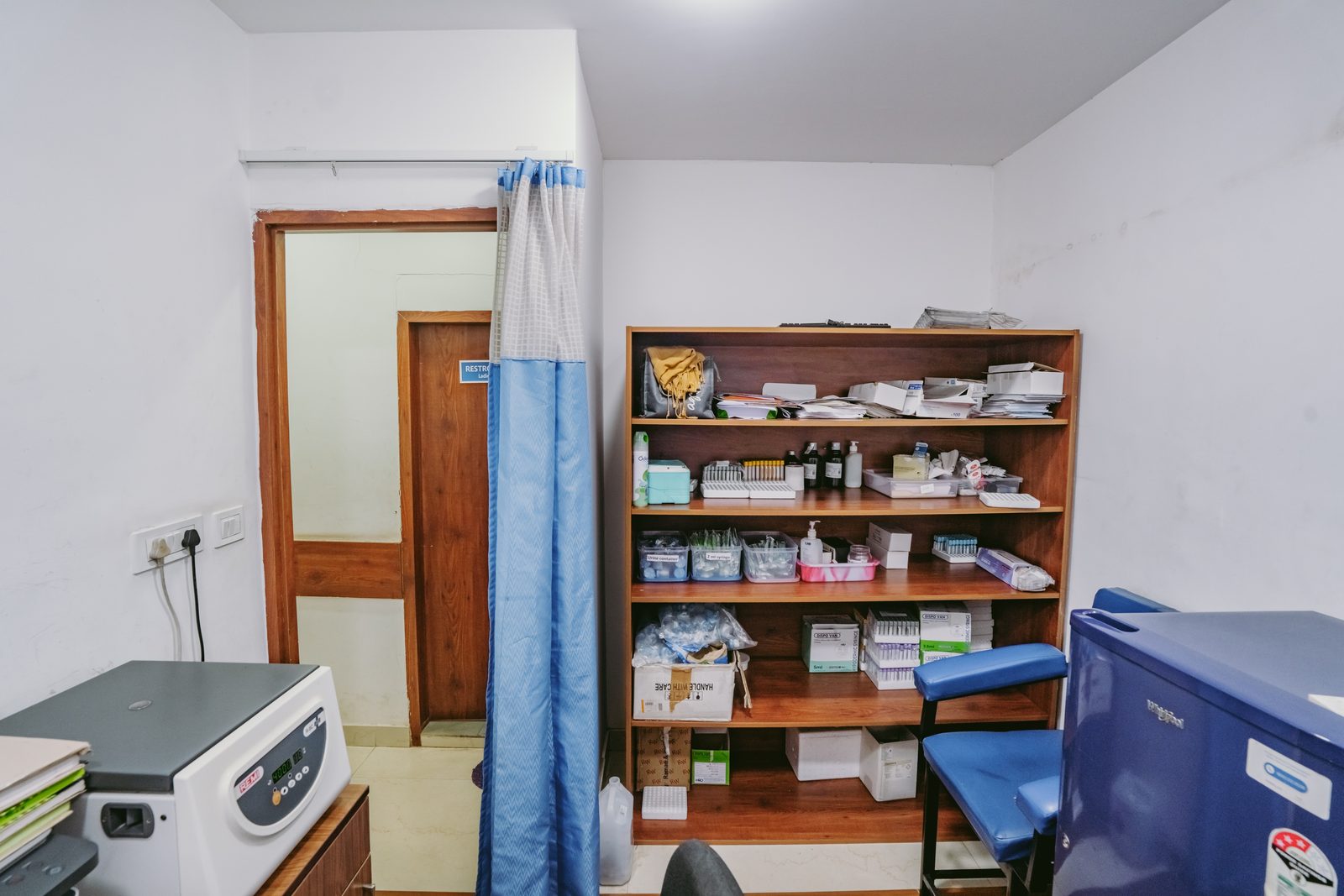 Supply store with shelving and exam bed