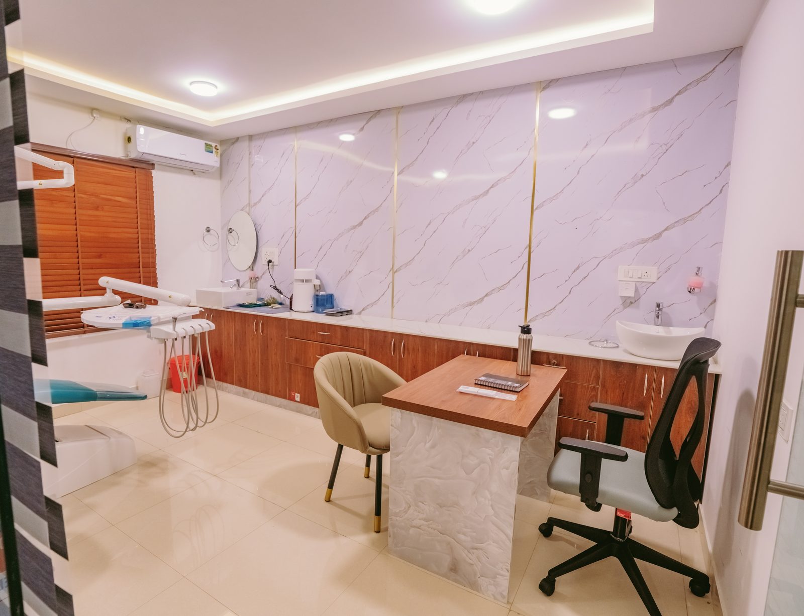 Dental operatory with marble wall and reception