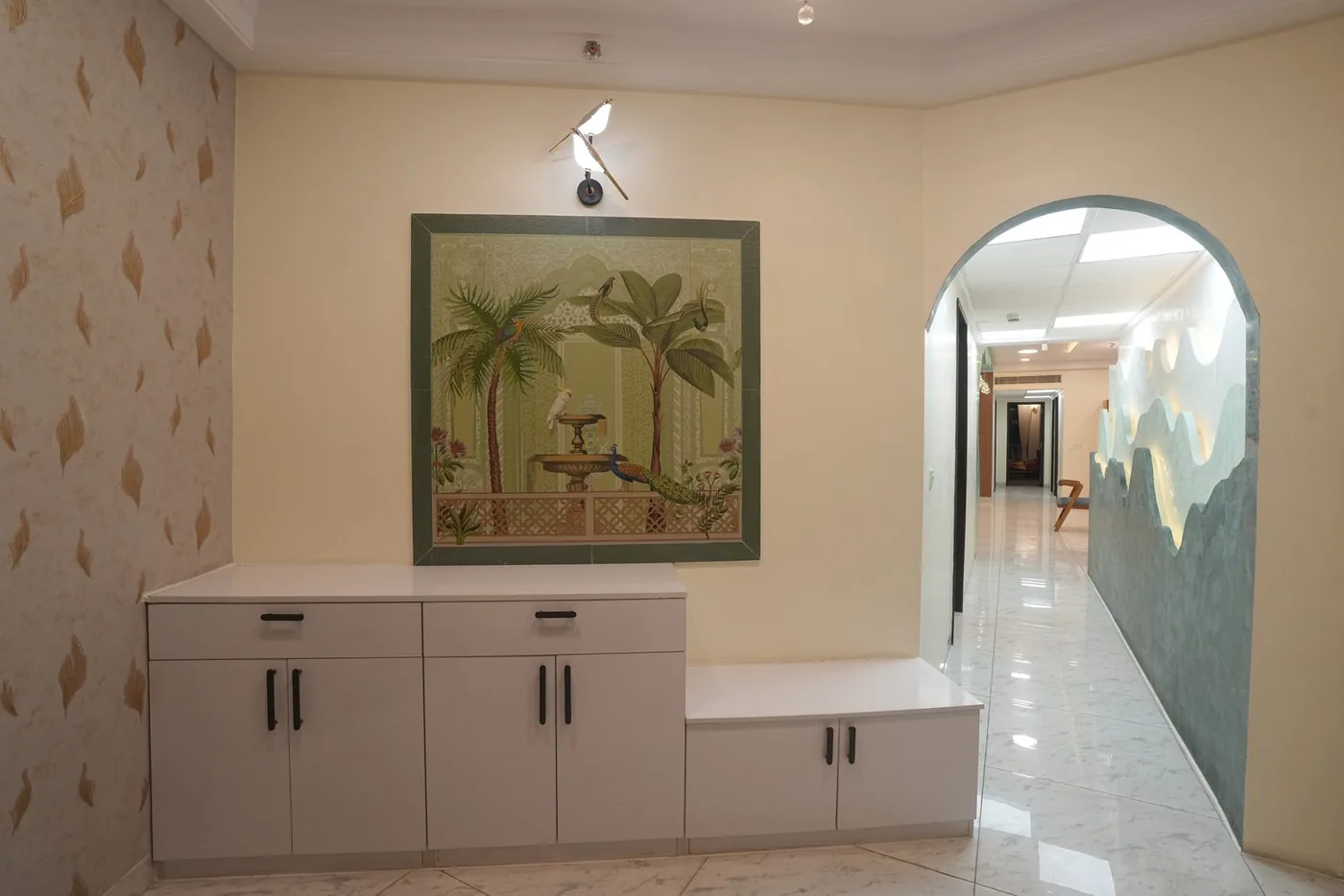Mantri Pinnacle residence entrance foyer with hand-painted mural and bench seating