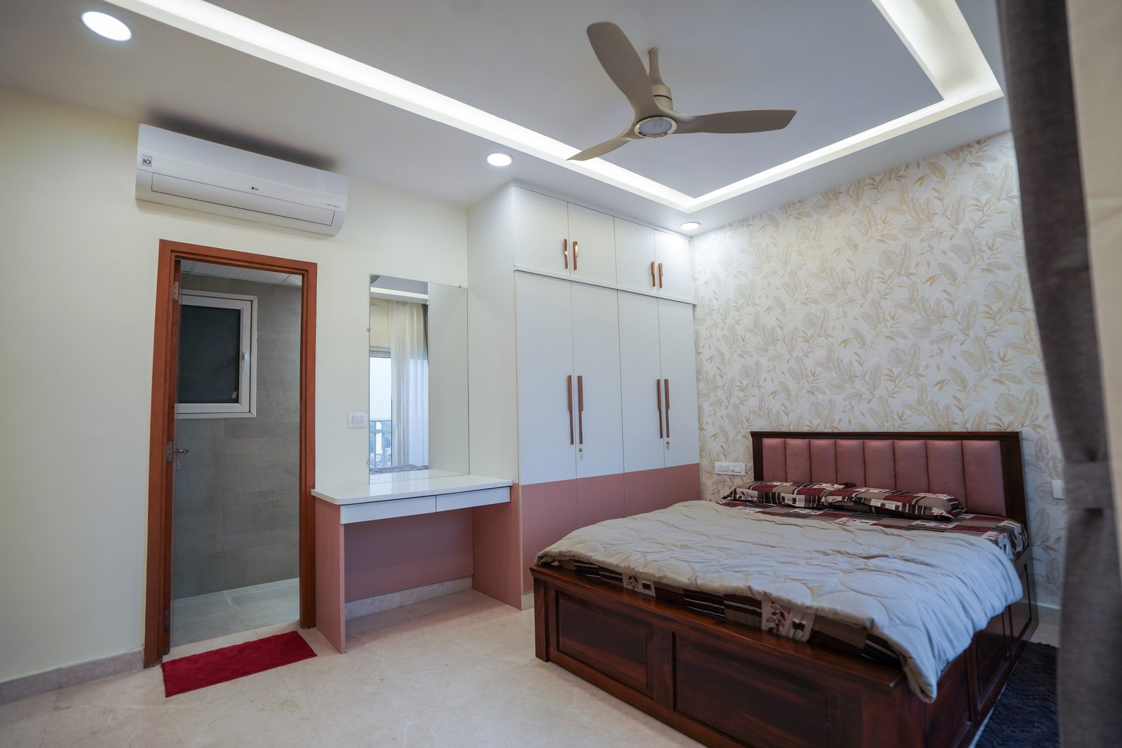 Bedroom with vanity and fitted wardrobe