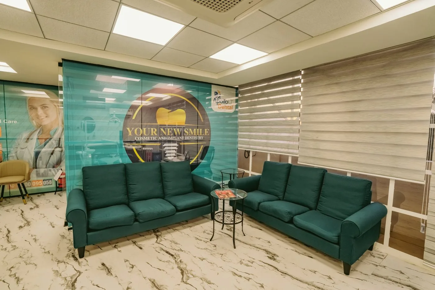Apollo Akshaya Nagar Reception Seating — Branded graphics anchor a comfortable waiting bay.