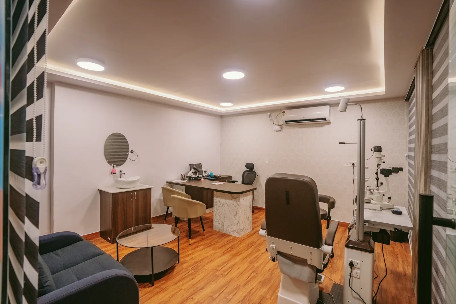 Apollo Bel Road Examination Room — Specialist equipment planned into a warm, ordered room.