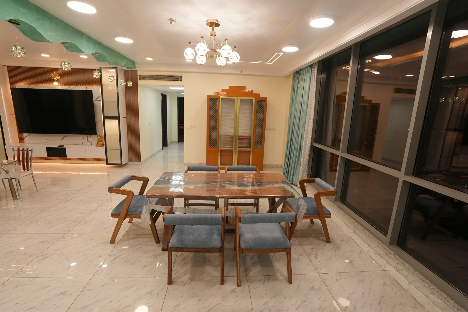 Mantri Pinnacle Dining and Lounge — Dining and media wall composed as one open plan.